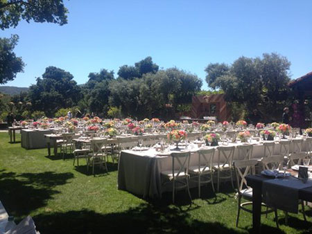 Long tables set up for outdoor event