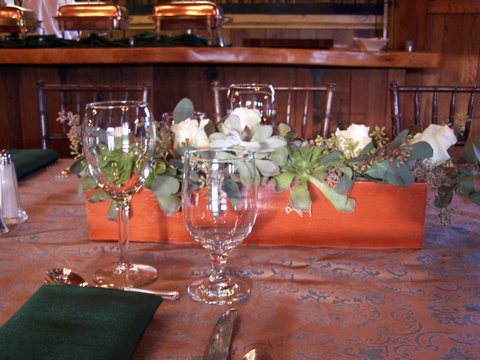 succulents and white roses centerpieces with tablesetting