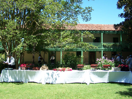 long table with serving trays and white tablecloth