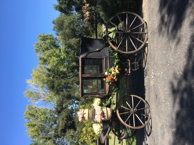 black carriage with floral decorations