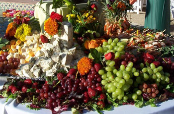 grapes and cheese display on table