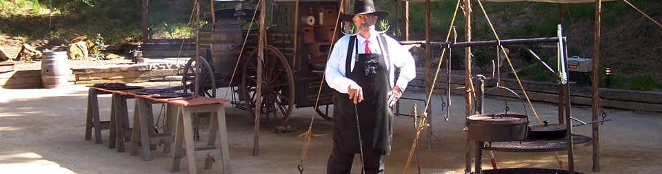 Billy cooking using a Dutch Oven