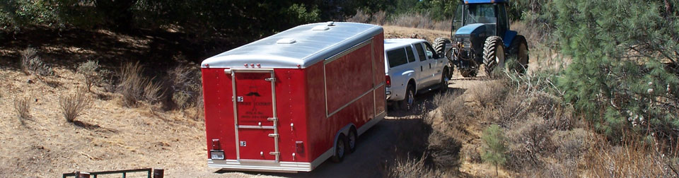 tractor towing a truck towing Big Red