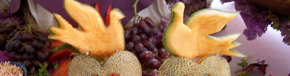 two cantelope doves in fruit salad